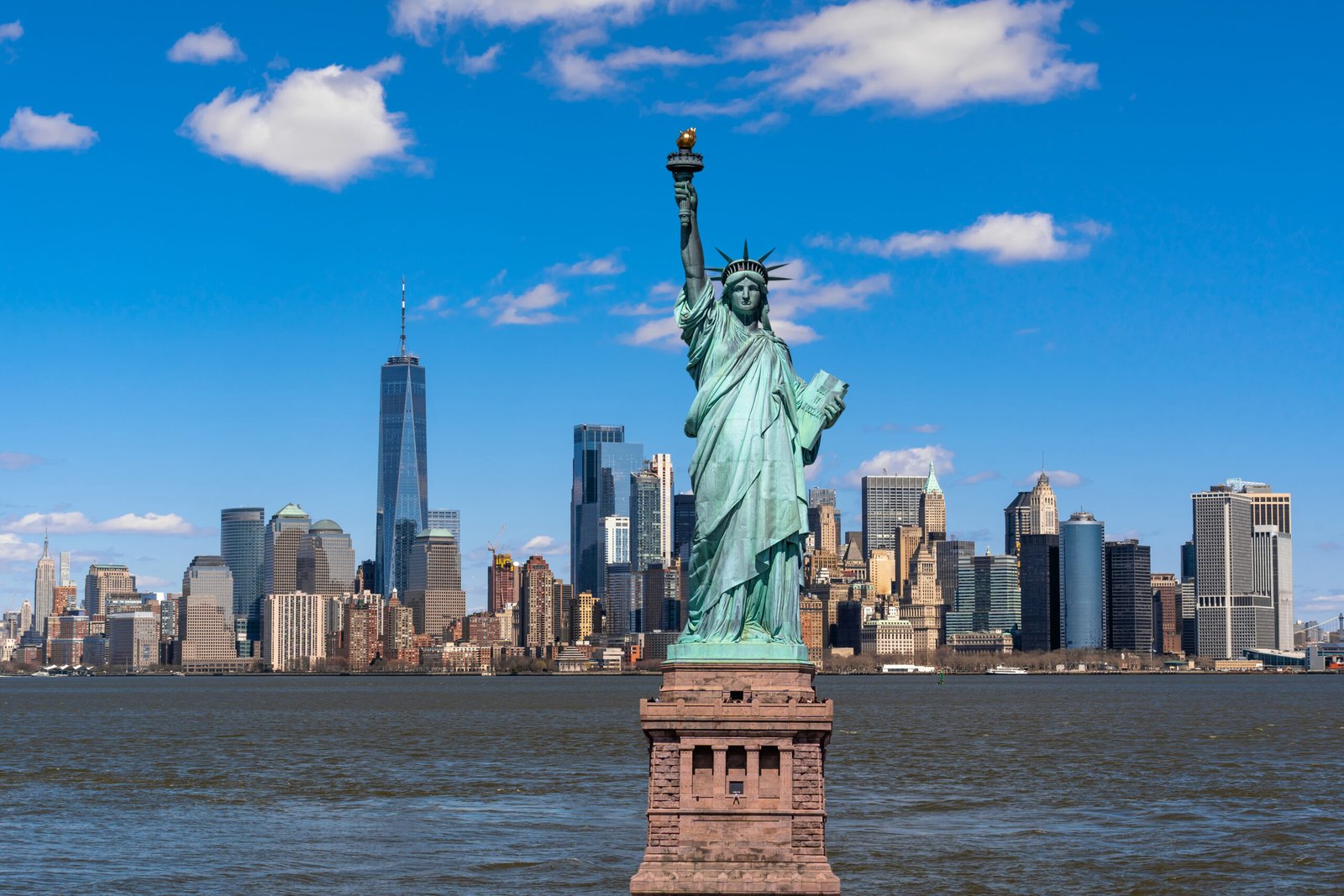 The Statue of Liberty over the Scene of New york cityscape river